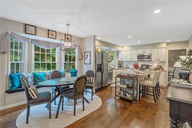 9607 Dunderry, Lysander, NY 13027 - dining space with dark wood finished floors, a chandelier, and recessed lighting