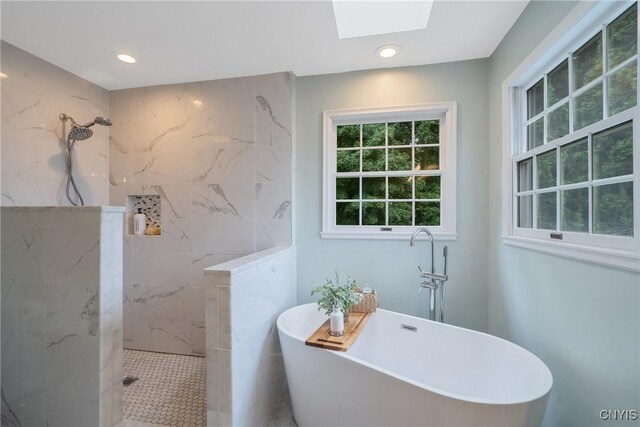 9607 Dunderry, Lysander, NY 13027 - full bathroom featuring a skylight, a marble finish shower, a freestanding tub, and recessed lighting