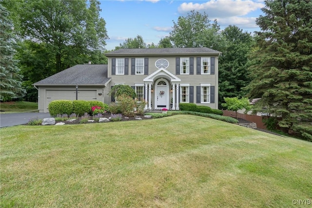9607 Dunderry, Lysander, NY 13027 - colonial house with asphalt driveway and an attached garage