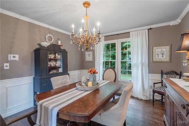 9607 Dunderry, Lysander, NY 13027 - dining room featuring a chandelier, a wainscoted wall, ornamental molding, dark wood-style floors, and a decorative wall