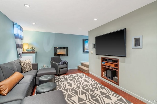 9607 Dunderry, Lysander, NY 13027 - living room featuring wood finished floors, stairway, and recessed lighting