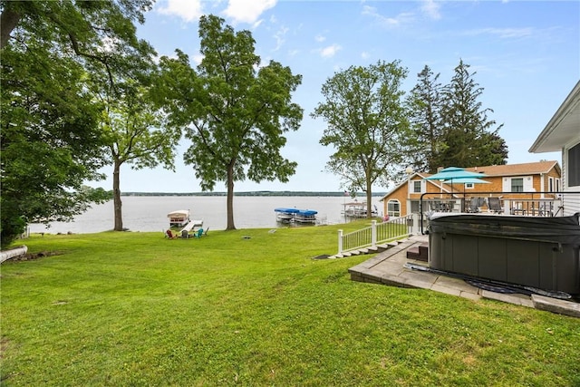 4969 Walnut Cove Dr, Canandaigua Town, NY 14424 - view of green lawn with a hot tub and a water view