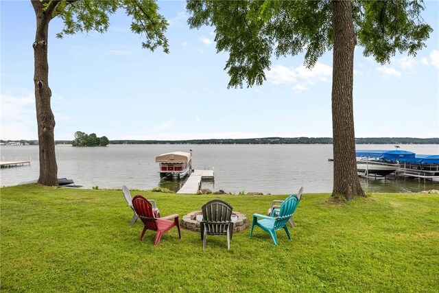 4969 Walnut Cove Dr, Canandaigua Town, NY 14424 - view of green lawn with a dock, a water view, a fire pit, and boat lift