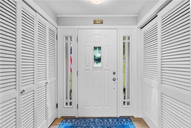 4969 Walnut Cove Dr, Canandaigua Town, NY 14424 - foyer entrance with light wood-style floors and ornamental molding