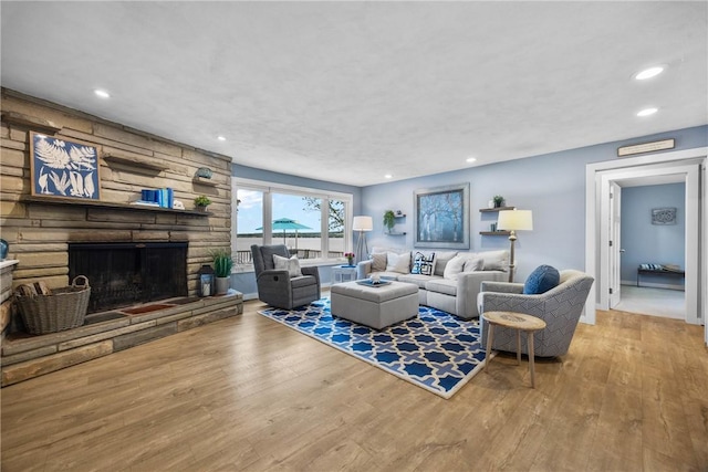 4969 Walnut Cove Dr, Canandaigua Town, NY 14424 - living room with wood finished floors, recessed lighting, and a fireplace