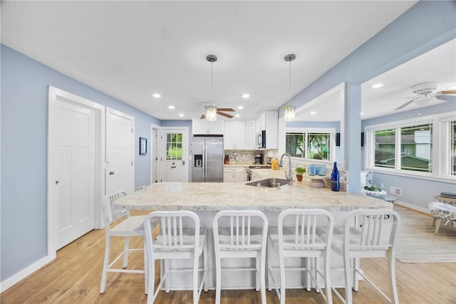 4969 Walnut Cove Dr, Canandaigua Town, NY 14424 - kitchen with stainless steel appliances, ceiling fan, a peninsula, plenty of natural light, and recessed lighting
