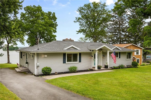 4969 Walnut Cove Dr, Canandaigua Town, NY 14424 - ranch-style house featuring a front yard, a chimney, and roof with shingles
