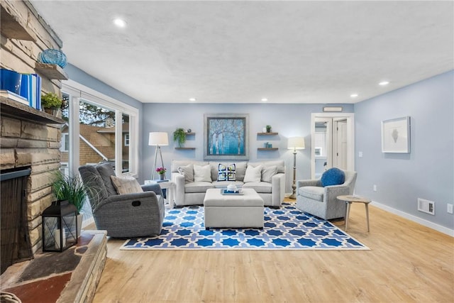 4969 Walnut Cove Dr, Canandaigua Town, NY 14424 - living room with a stone fireplace, wood finished floors, and recessed lighting