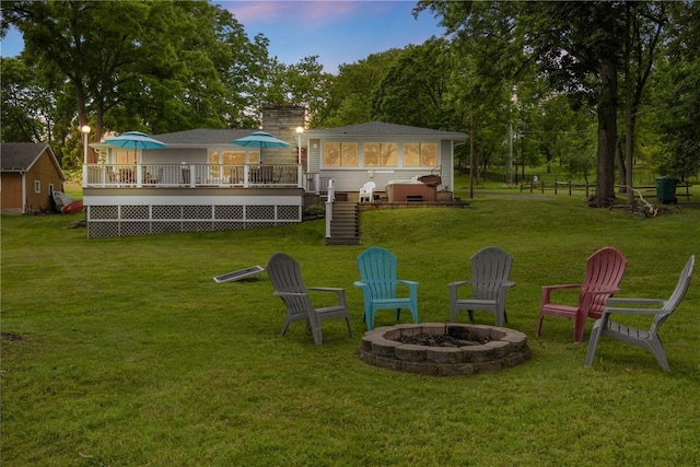 4969 Walnut Cove Dr, Canandaigua Town, NY 14424 - view of green lawn featuring an outdoor fire pit, a wooden deck, and stairway