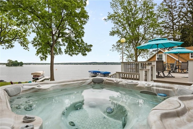 4969 Walnut Cove Dr, Canandaigua Town, NY 14424 - view of swimming pool with a hot tub, a deck with water view, and outdoor dining area