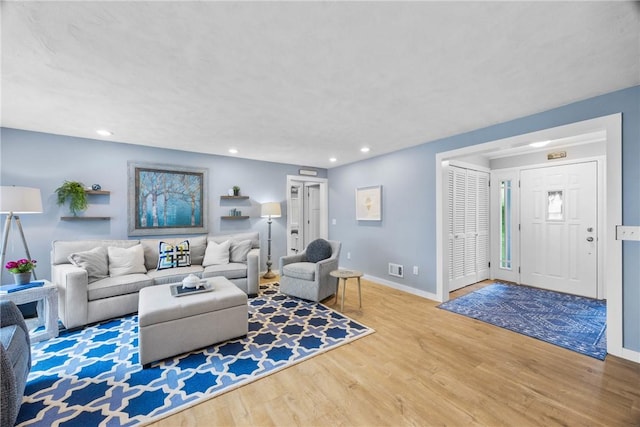 4969 Walnut Cove Dr, Canandaigua Town, NY 14424 - living room featuring wood finished floors and recessed lighting