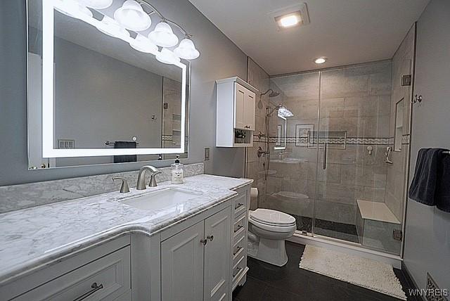 114 Slate Bottom Dr, Lancaster, NY 14043 - bathroom featuring vanity, a shower stall, and tile patterned floors