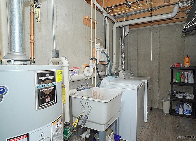 114 Slate Bottom Dr, Lancaster, NY 14043 - laundry area featuring water heater, washer and clothes dryer, and wood finished floors