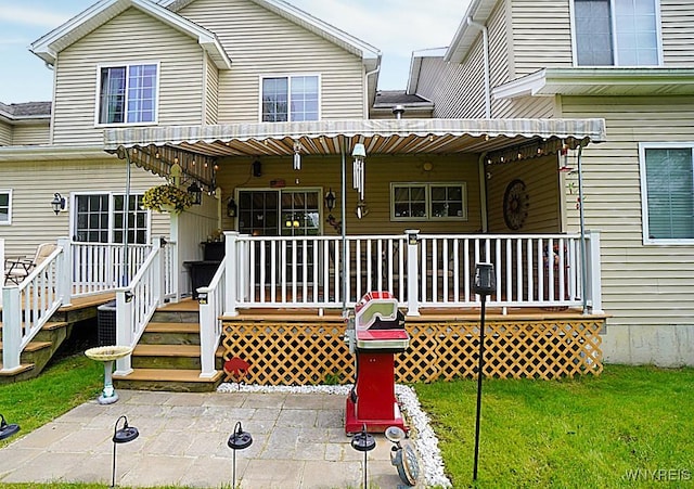 114 Slate Bottom Dr, Lancaster, NY 14043 - back of property with covered porch and a yard