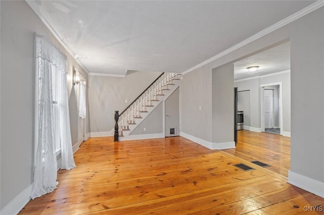 17 Burr St, Cazenovia, NY 13035 - entrance foyer with stairway, ornamental molding, and light wood-style floors