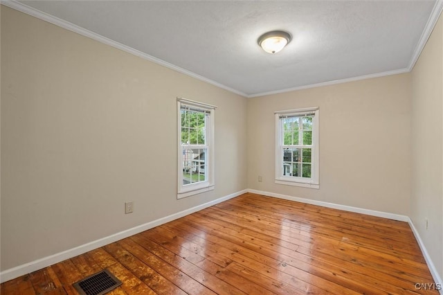 17 Burr St, Cazenovia, NY 13035 - empty room with ornamental molding and hardwood / wood-style flooring