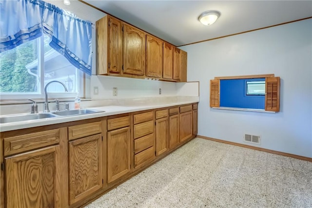 28 Berna Ln, Chili, NY 14624 - kitchen featuring brown cabinets and light countertops