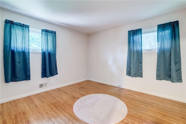 28 Berna Ln, Chili, NY 14624 - spare room with plenty of natural light and wood finished floors