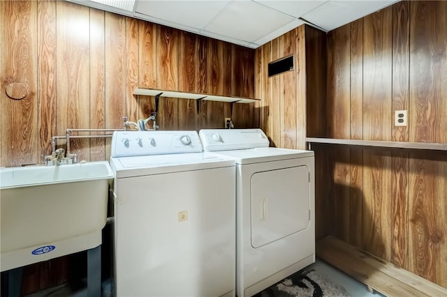 28 Berna Ln, Chili, NY 14624 - laundry room featuring wood walls and independent washer and dryer