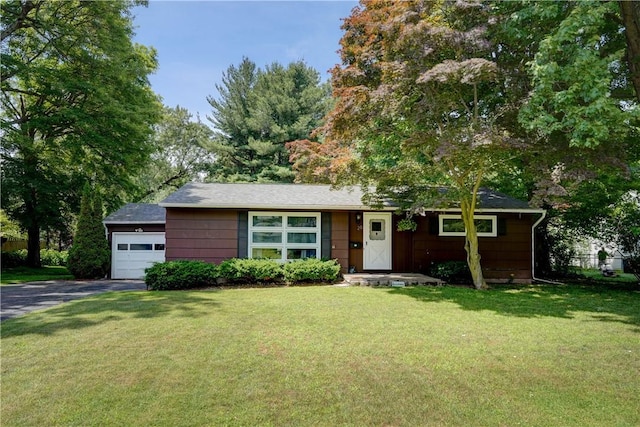 28 Berna Ln, Chili, NY 14624 - single story home with a front lawn, driveway, and a garage