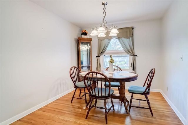 28 Berna Ln, Chili, NY 14624 - dining room featuring a chandelier and light wood-style floors