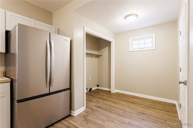 708 Garson Ave, Rochester, NY 14609 - washroom featuring light wood-type flooring and baseboards