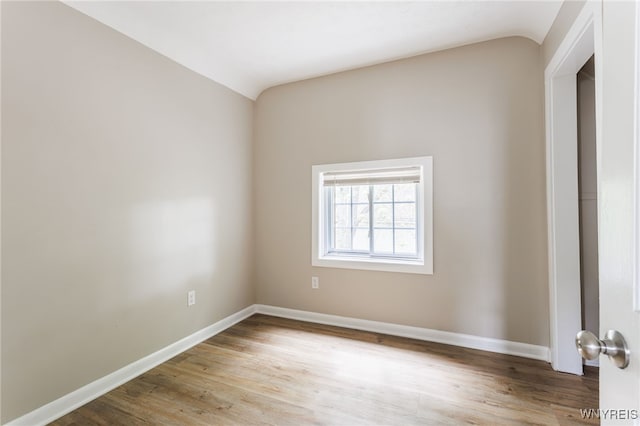 708 Garson Ave, Rochester, NY 14609 - unfurnished room with lofted ceiling and wood finished floors