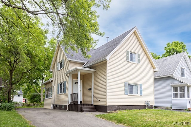 708 Garson Ave, Rochester, NY 14609 - view of front of home with a front yard, driveway, and a shingled roof