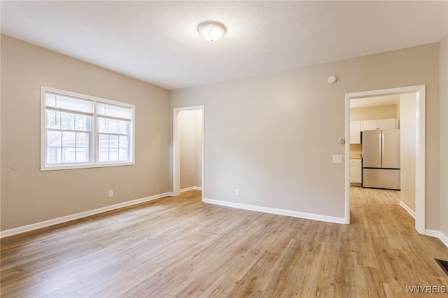708 Garson Ave, Rochester, NY 14609 - unfurnished room featuring light wood finished floors and a smoke detector