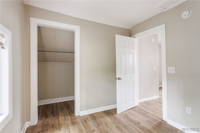 708 Garson Ave, Rochester, NY 14609 - unfurnished bedroom with light wood finished floors and a closet