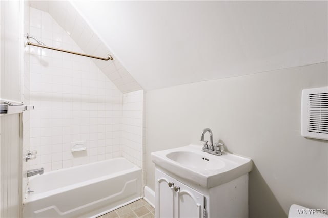 708 Garson Ave, Rochester, NY 14609 - bathroom featuring shower / bath combination, vanity, and lofted ceiling