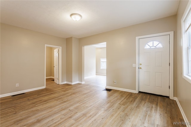 708 Garson Ave, Rochester, NY 14609 - entryway featuring light wood-style flooring and baseboards