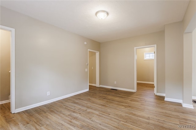 708 Garson Ave, Rochester, NY 14609 - spare room featuring light wood-style floors and baseboards