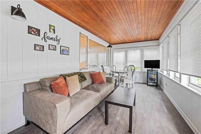 1732 Buffalo Rd, Gates, NY 14624 - living area featuring wooden ceiling, a decorative wall, wood finished floors, and crown molding