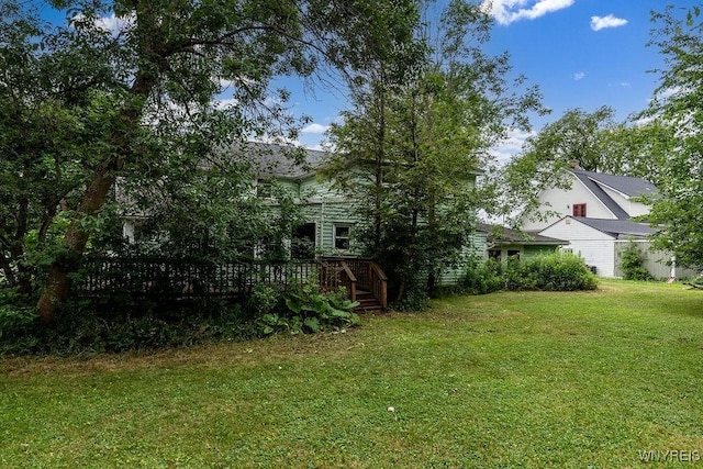 1065 W River Rd, Grand Island, NY 14072 - view of green lawn featuring a wooden deck