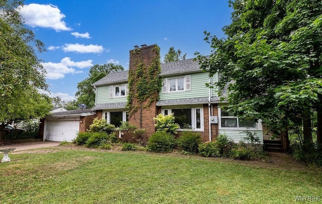 1065 W River Rd, Grand Island, NY 14072 - traditional-style home featuring a garage, a front yard, brick siding, a chimney, and concrete driveway