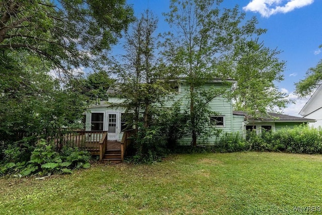 1065 W River Rd, Grand Island, NY 14072 - rear view of property with a deck and a lawn