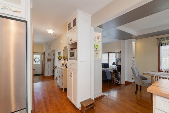 157 Dennis Ave, Hornell, NY 14843 - kitchen with appliances with stainless steel finishes, light wood-style flooring, white cabinets, glass insert cabinets, and an office area