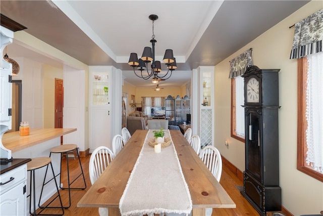 157 Dennis Ave, Hornell, NY 14843 - dining room with light wood-style flooring, a chandelier, and healthy amount of natural light