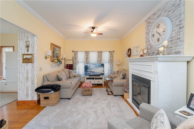 157 Dennis Ave, Hornell, NY 14843 - living room with wood finished floors, ornamental molding, a ceiling fan, and a glass covered fireplace
