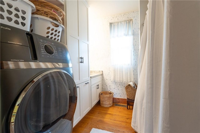 157 Dennis Ave, Hornell, NY 14843 - washroom featuring cabinet space, washer / dryer, and light wood-style flooring