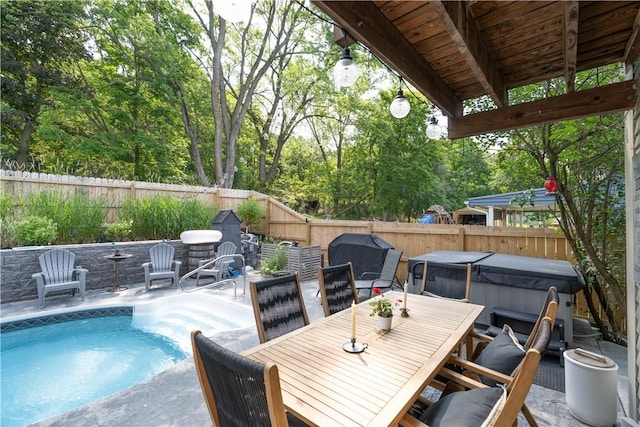 157 Dennis Ave, Hornell, NY 14843 - fenced backyard featuring a hot tub, a patio, and outdoor dining space