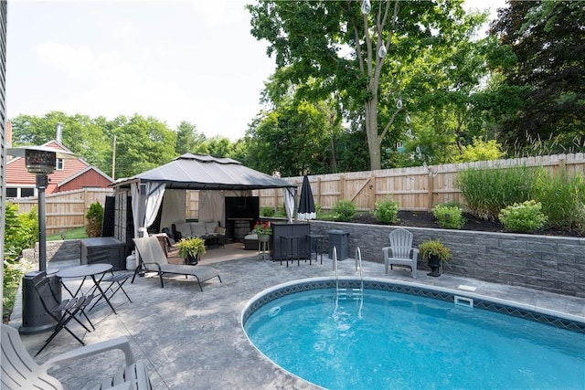157 Dennis Ave, Hornell, NY 14843 - view of swimming pool featuring a gazebo, outdoor lounge area, a patio area, and a fenced backyard