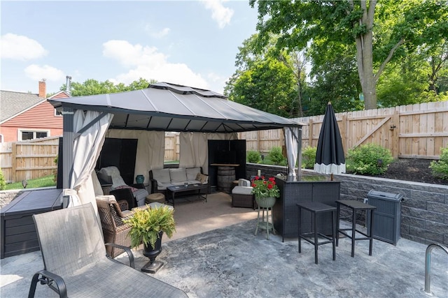157 Dennis Ave, Hornell, NY 14843 - fenced backyard with a gazebo, outdoor lounge area, and a patio area