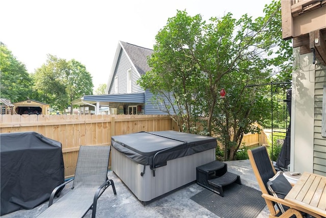 157 Dennis Ave, Hornell, NY 14843 - fenced backyard with a hot tub, area for grilling, and a patio