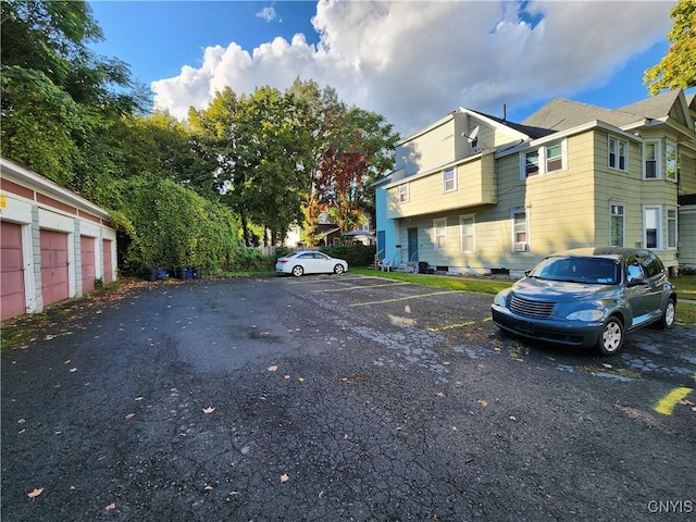 116 E Heman St, Dewitt, NY 13057 - uncovered parking lot featuring a residential view