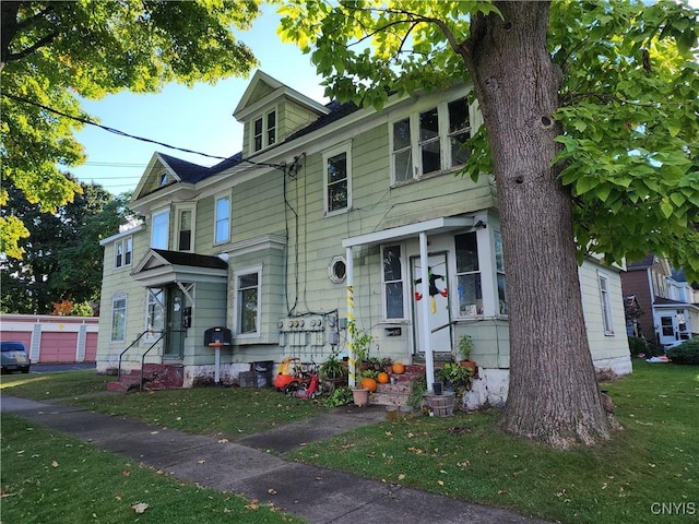 116 E Heman St, Dewitt, NY 13057 - view of front of home with a front lawn