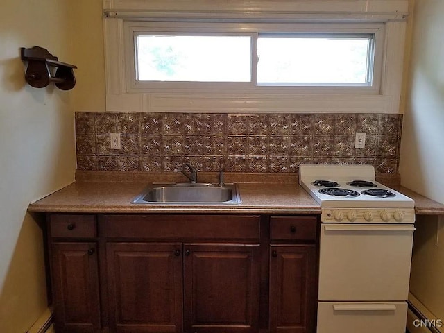 116 E Heman St, Dewitt, NY 13057 - kitchen featuring white range with electric stovetop and backsplash