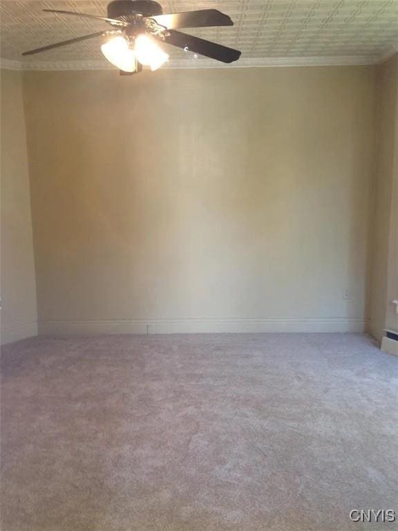 116 E Heman St, Dewitt, NY 13057 - empty room featuring an ornate ceiling, ceiling fan, ornamental molding, and carpet