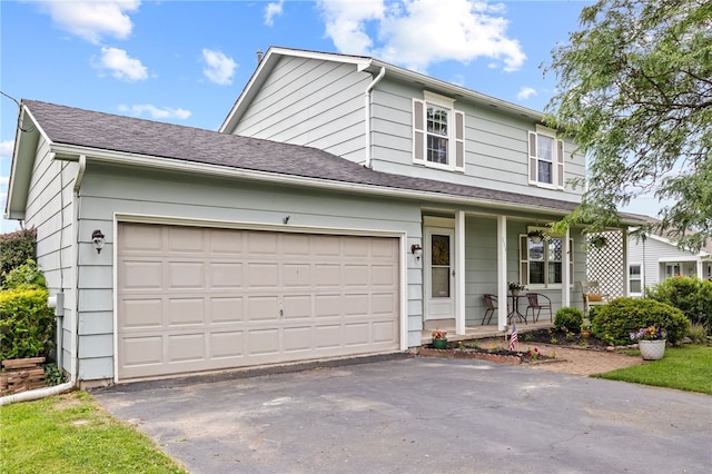 111 Farrell Road Ext, Henrietta, NY 14586 - traditional-style house featuring a porch, driveway, and an attached garage